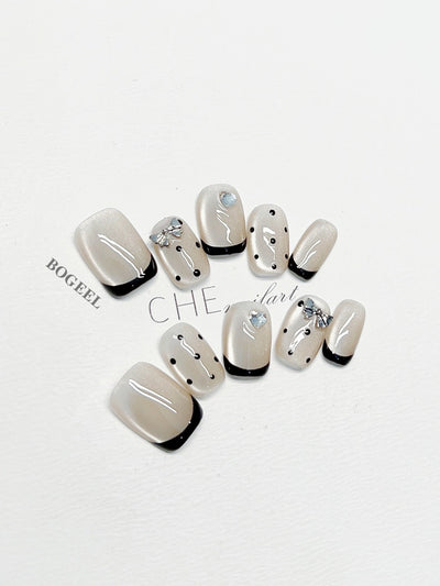 Cat-eye polka dot nail art