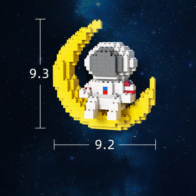Astronauts assemble building block toys.