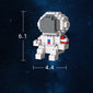 Astronauts assemble building block toys.