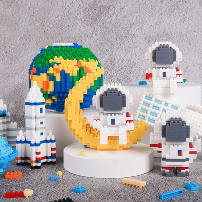 Astronauts assemble building block toys.