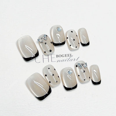 Cat-eye polka dot nail art