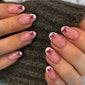 Stylish French manicure with a bow design.