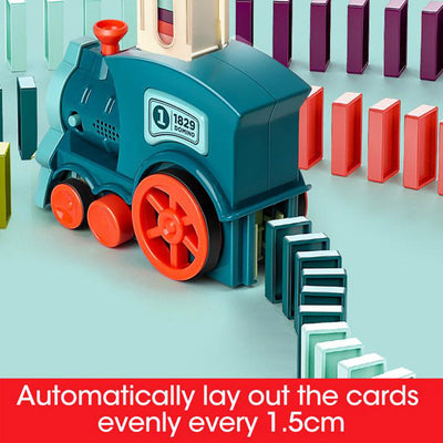 The miniature train automatically sets up dominoes.