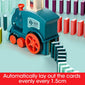 The miniature train automatically sets up dominoes.