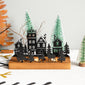 Christmas-themed wooden candle holder